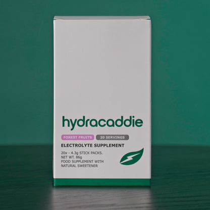 Box of hydracaddie forest fruits electrolyte supplement on a green background