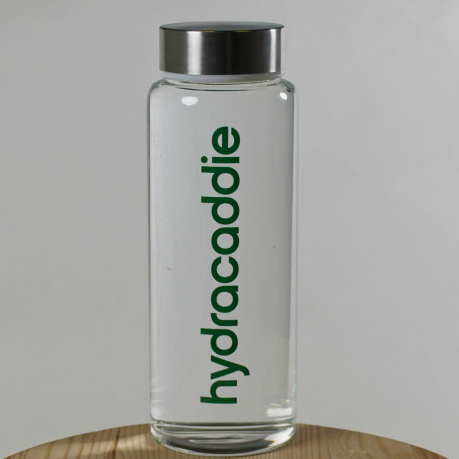 Product image for the hydracaddie lifestyle bottle. A premium glass bottle with stainless steel lid on a white background.