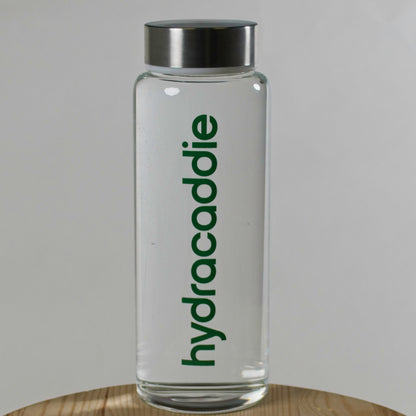 Product image for the hydracaddie lifestyle bottle. A premium glass bottle with stainless steel lid on a white background.